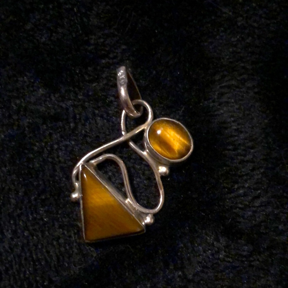 Tiger eyes set in real silver pendant